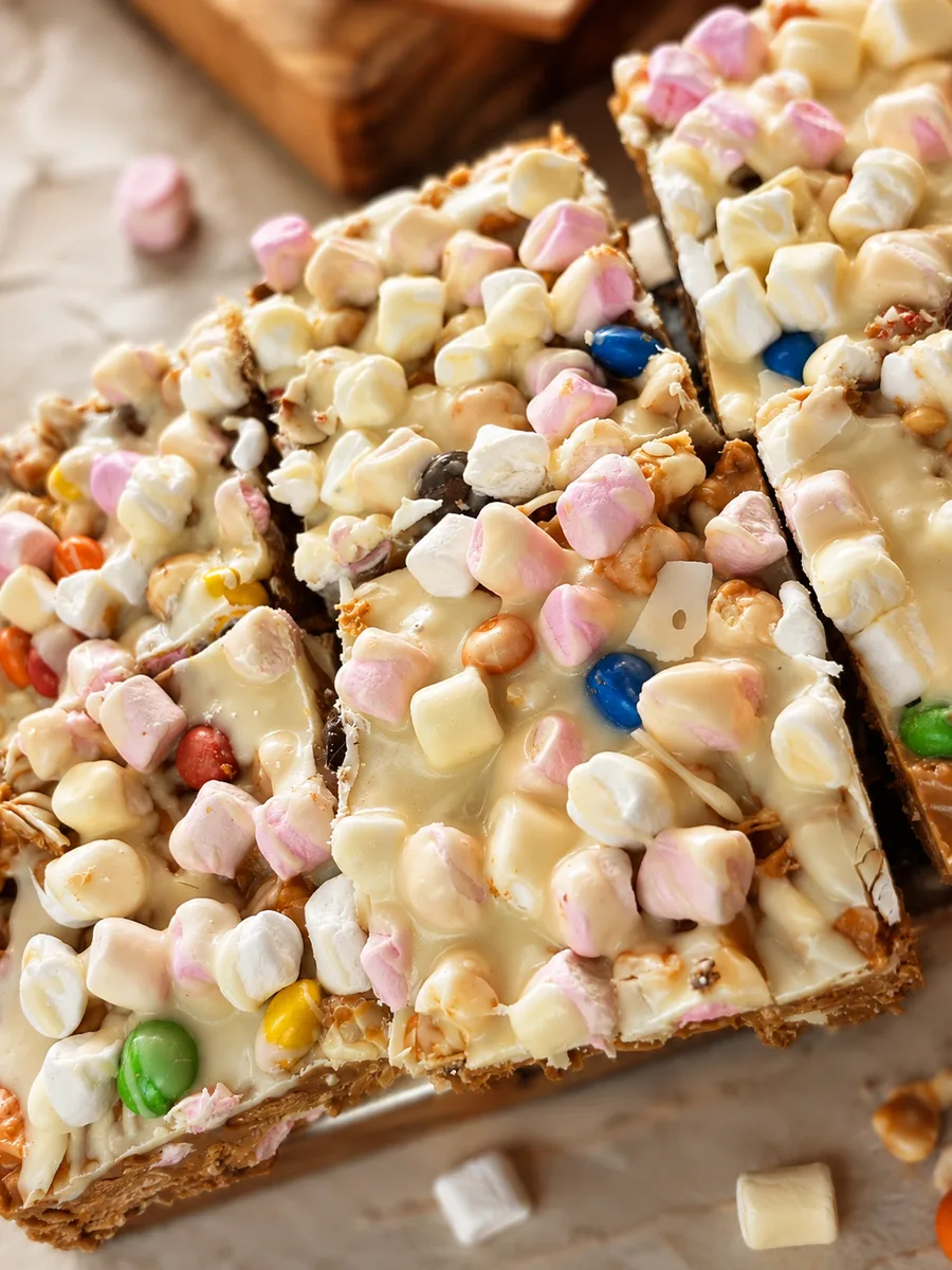 White chocolate dessert bars topped with marshmallows and sweets